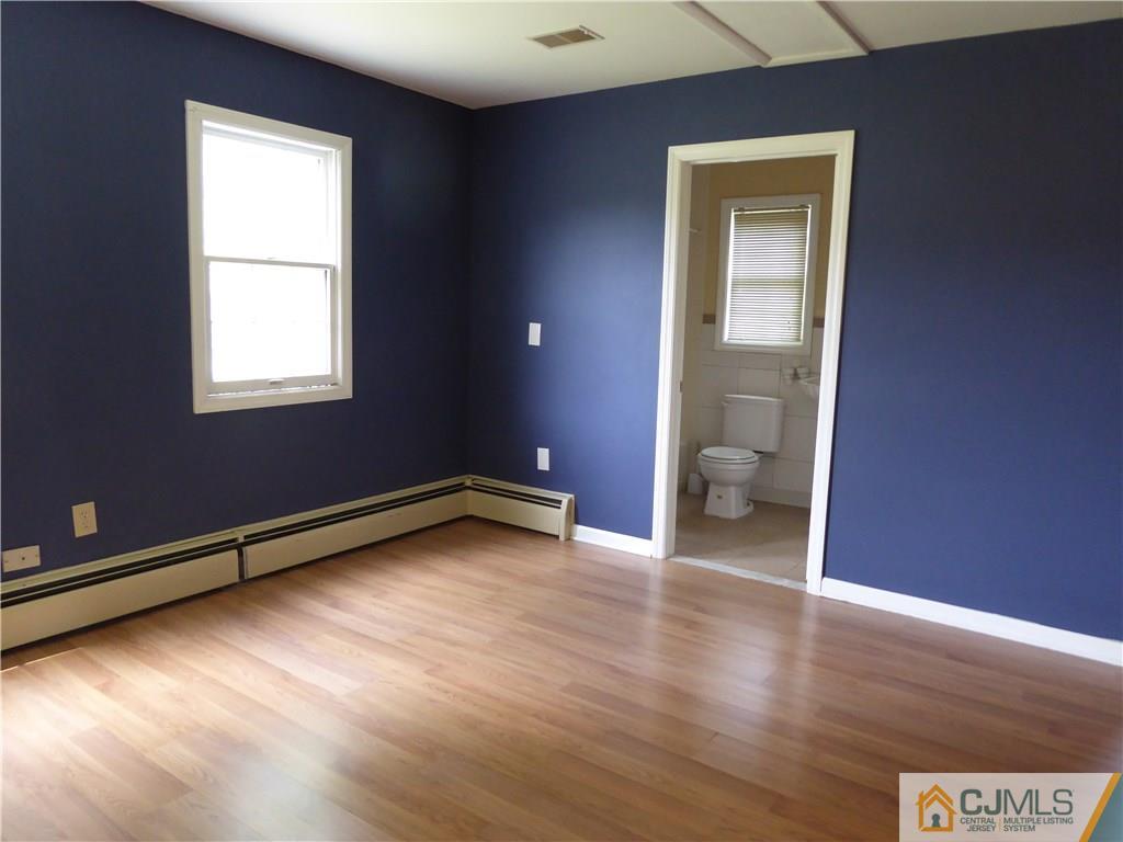 38 Stony Road West Edison, NJ 08817 - Photo 22 of 42 a view of a room with wooden floor and window