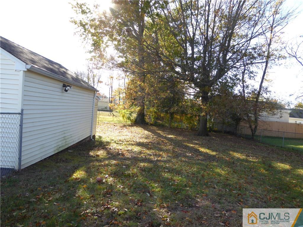 38 Stony Road West Edison, NJ 08817 - Photo 30 of 42 a view of a yard with trees and plants