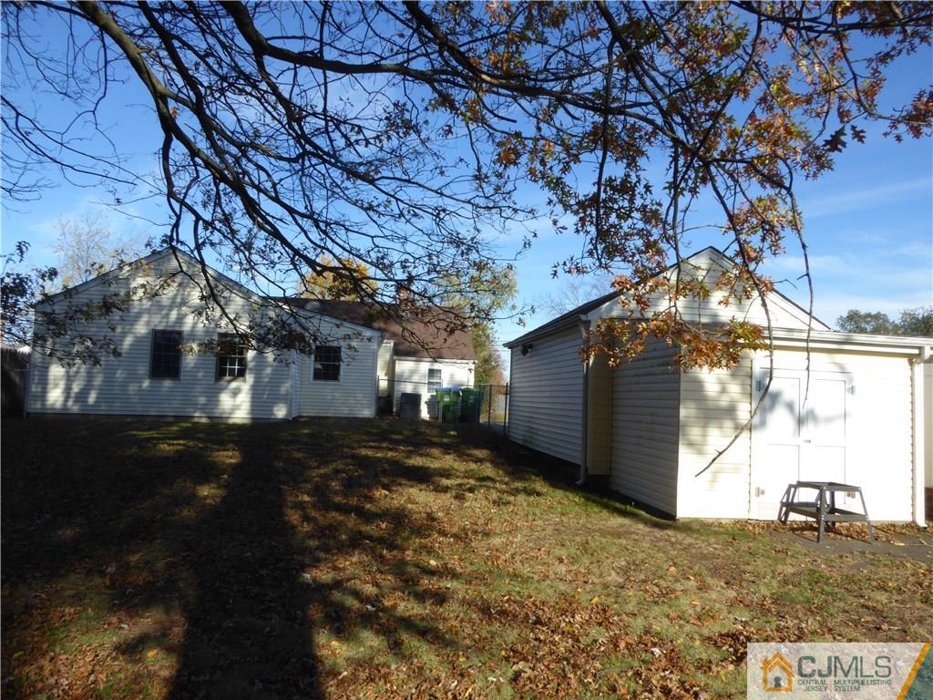 38 Stony Road West Edison, NJ 08817 - Photo 31 of 42 a view of a yard with a large tree