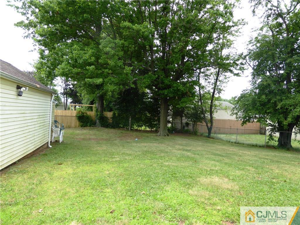 38 Stony Road West Edison, NJ 08817 - Photo 40 of 42 a view of a backyard with a trees