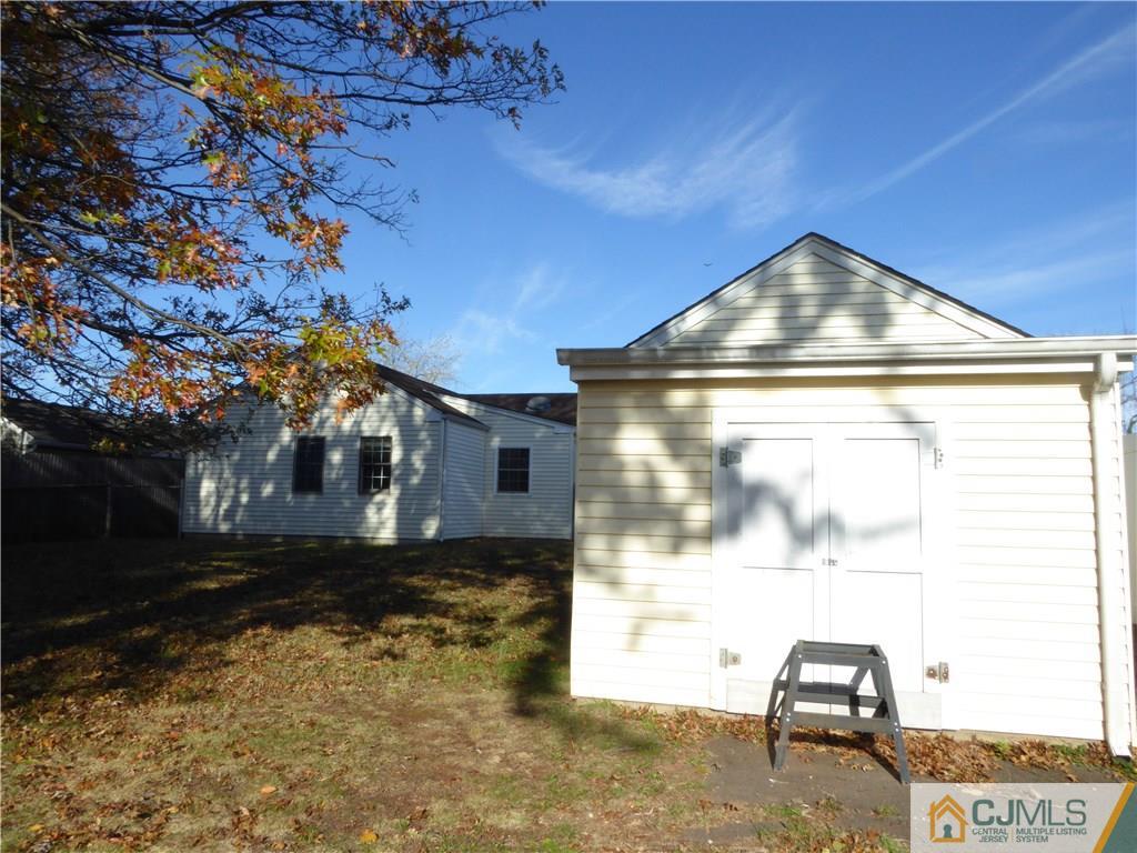 38 Stony Road West Edison, NJ 08817 - Photo 5 of 42 a front view of a house with a yard
