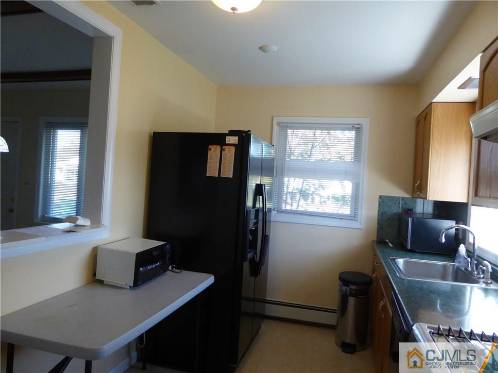 38 Stony Road West Edison, NJ 08817 - Photo 6 of 42 a view of a workspace with furniture and a window