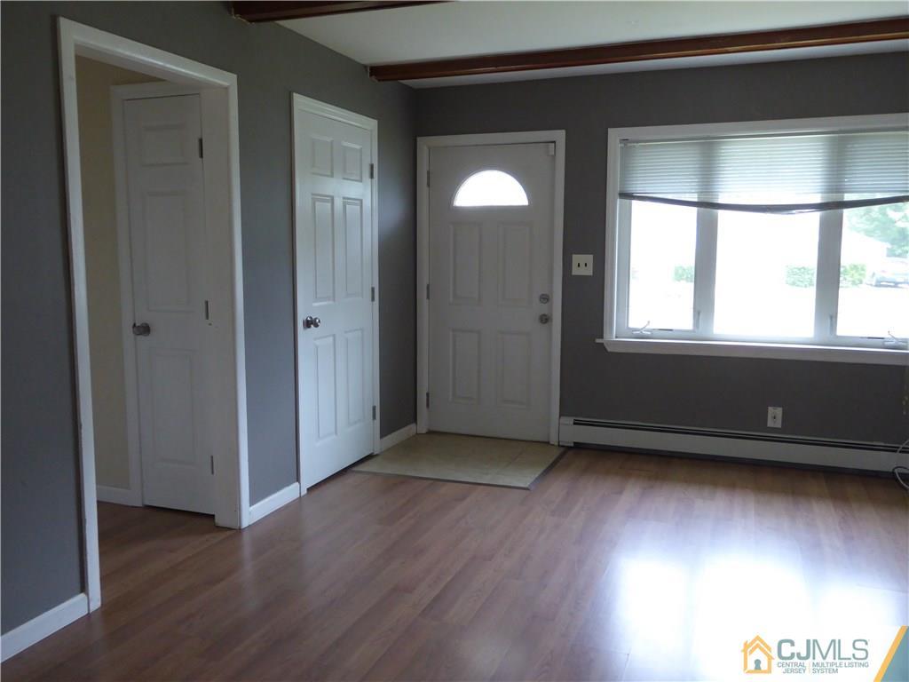38 Stony Road West Edison, NJ 08817 - Photo 9 of 42 an empty room with wooden floor and windows