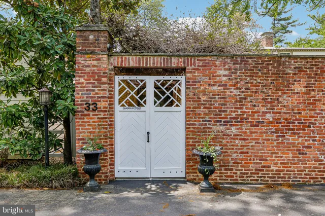 a view of a brick house with a large windows