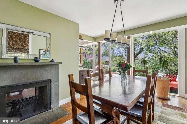 a view of a room that has a large window and a bed
