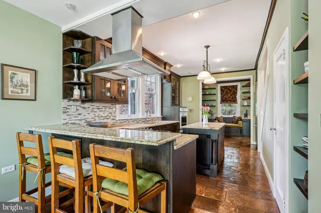 a view of a room with furniture and a rug