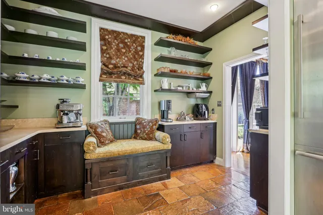 a view of a chairs and tables in the patio of the house