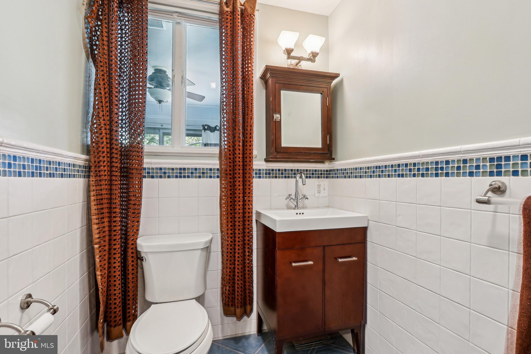 33 Rosedale Road Princeton, NJ 08540 - Photo 47 of 75 a bathroom with a toilet a sink and mirror