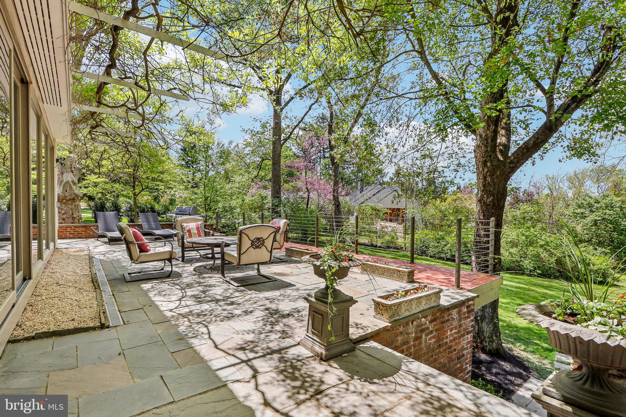 33 Rosedale Road Princeton, NJ 08540 - Photo 60 of 75 a view of a patio with table and chairs potted plants and large tree