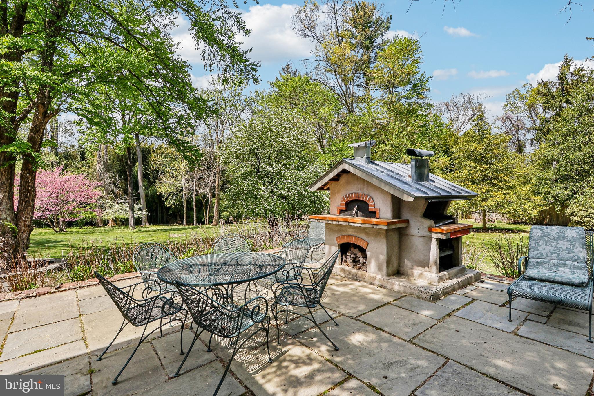 33 Rosedale Road Princeton, NJ 08540 - Photo 65 of 75 a view of a patio with table and chairs potted plants and a large tree