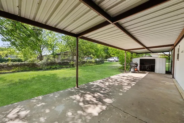 a view of a porch with a garden