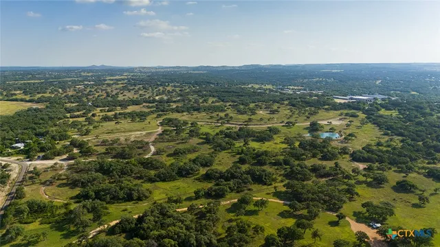 an aerial view of residential house and green space