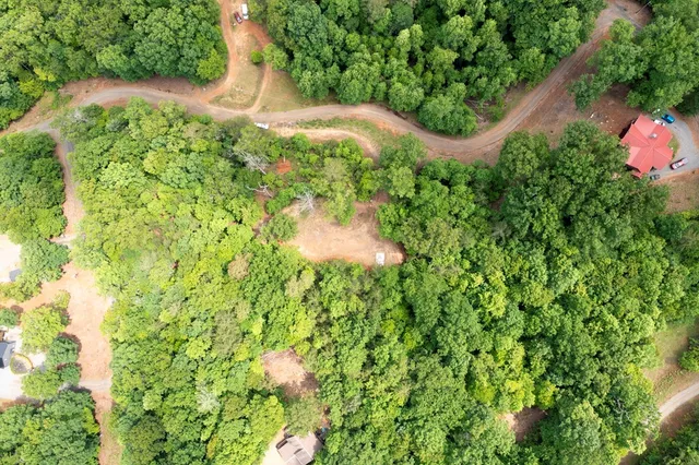 a backyard of a house with a yard and outdoor seating