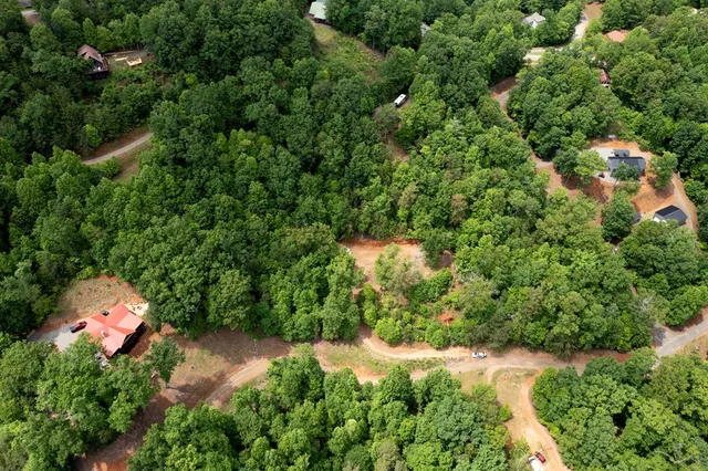 a backyard of a house with a yard and outdoor seating