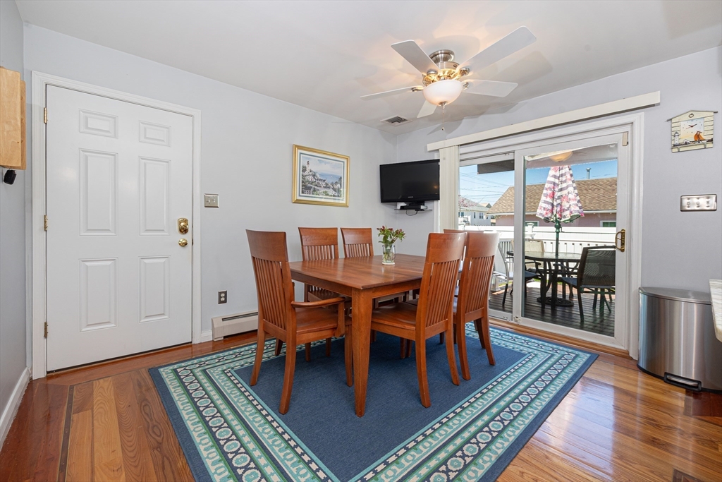 59 J Street Hull, MA 02045 - Photo 12 of 35 a view of a dining room with furniture window and wooden floor