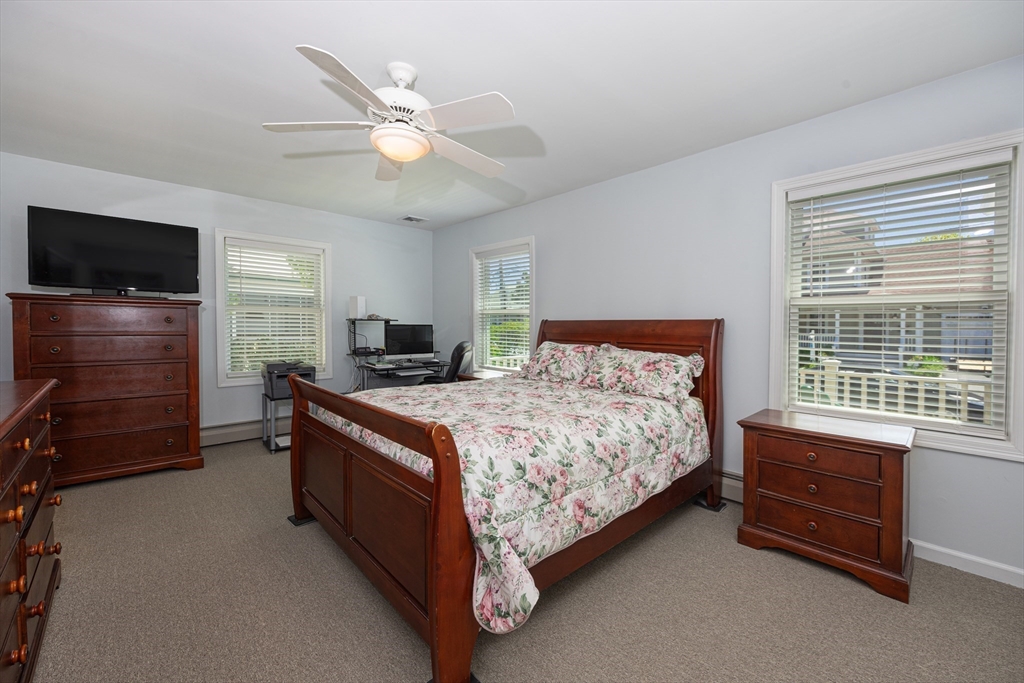 59 J Street Hull, MA 02045 - Photo 21 of 35 a bed room with a bed and a television
