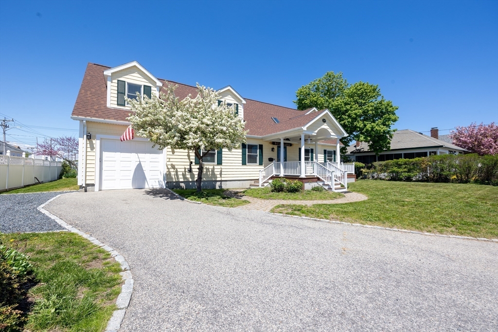 59 J Street Hull, MA 02045 - Photo 3 of 35 a front view of a house with a yard