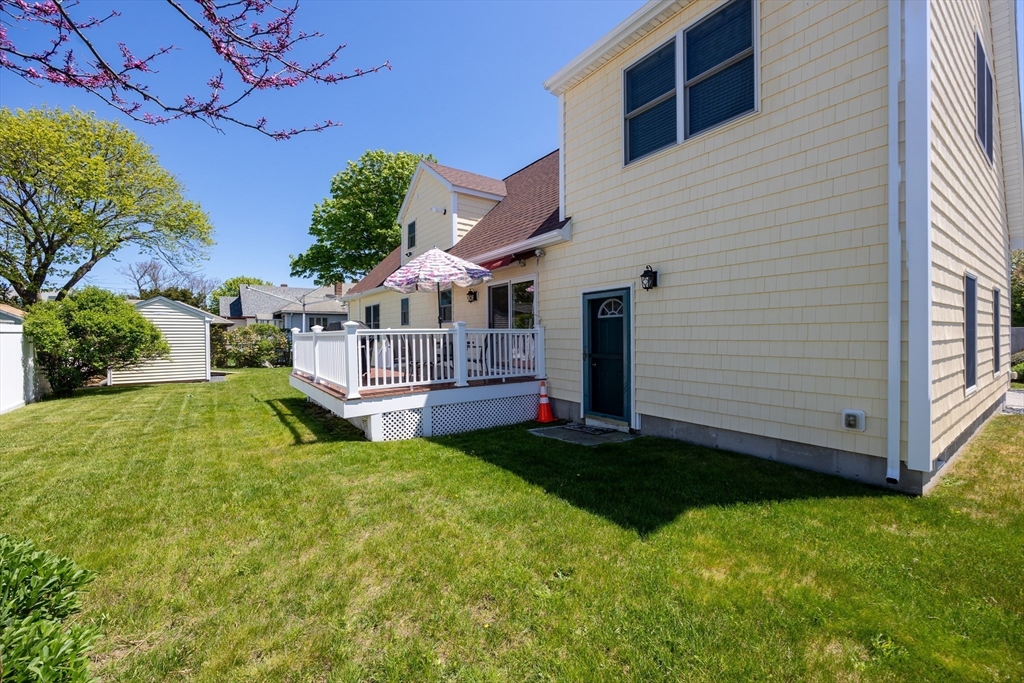 59 J Street Hull, MA 02045 - Photo 32 of 35 a view of a house with a yard porch and sitting area