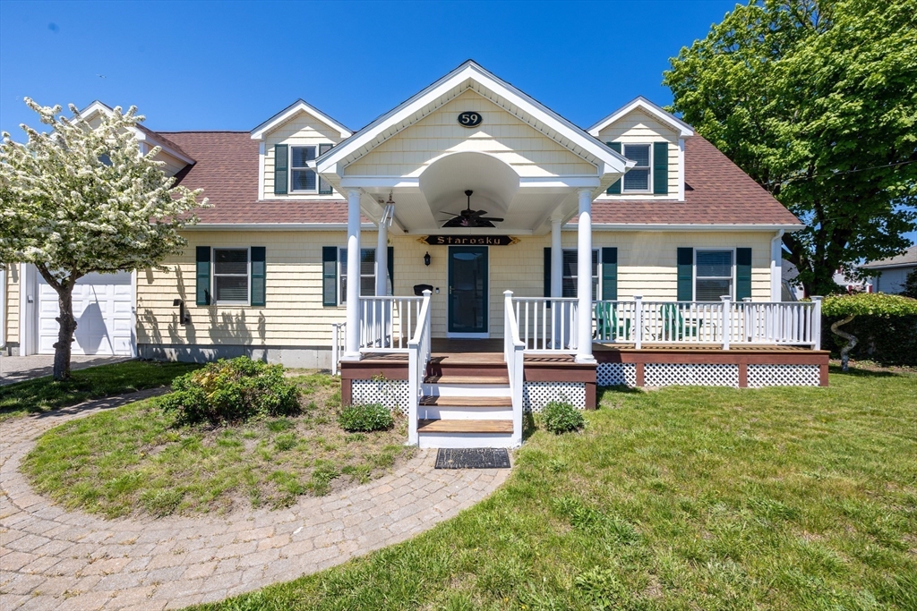 59 J Street Hull, MA 02045 - Photo 5 of 35 a front view of a house with a yard
