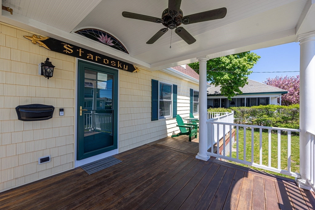 59 J Street Hull, MA 02045 - Photo 7 of 35 a view of a porch with furniture and a yard