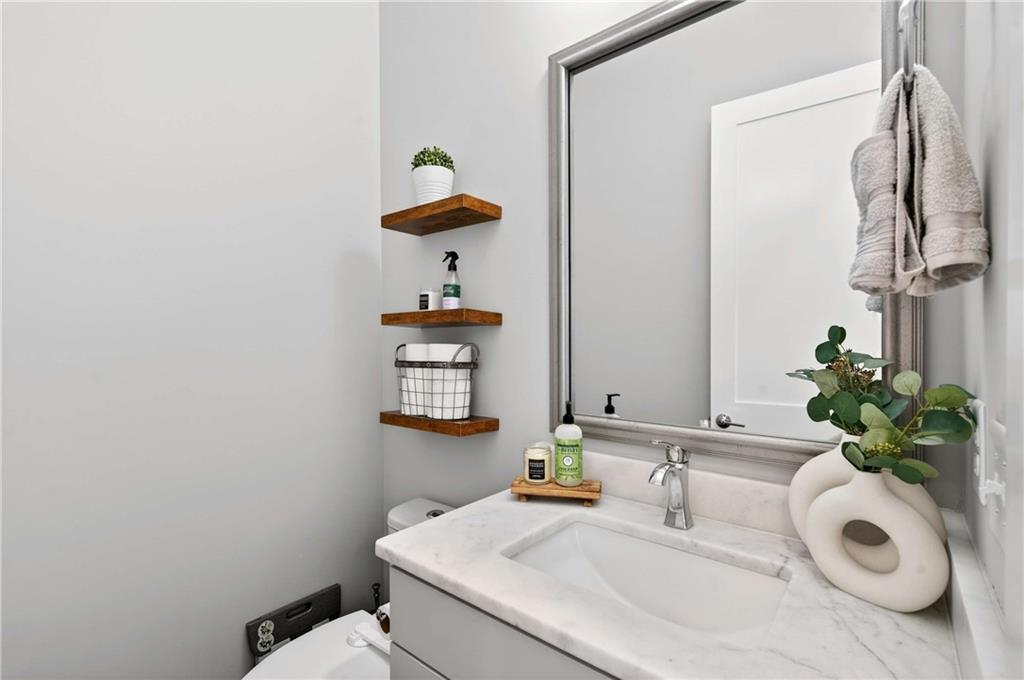 2974 Hermance Drive Northeast Atlanta, GA 30319 - Photo 29 of 38 a bathroom with a sink toilet and a mirror
