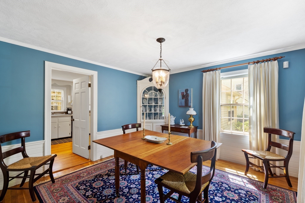 4 Longfellow Road Lexington, MA 02420 - Photo 15 of 37 a dining room with a table or chairs and a wooden floor