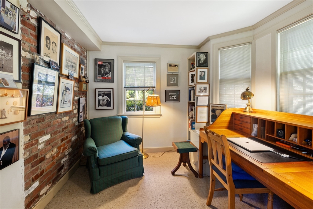 4 Longfellow Road Lexington, MA 02420 - Photo 19 of 37 a living room with furniture and a book shelf