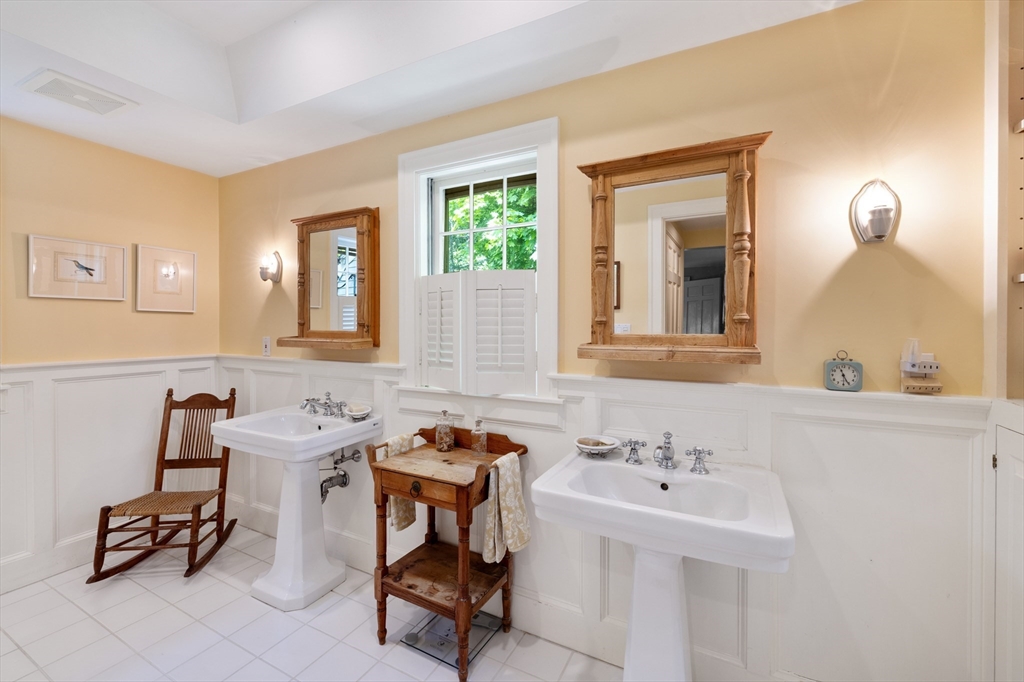 4 Longfellow Road Lexington, MA 02420 - Photo 23 of 37 a bathroom with a sink and a mirror