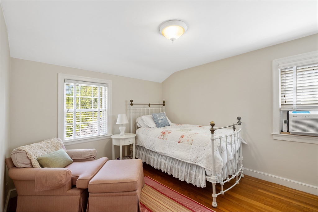4 Longfellow Road Lexington, MA 02420 - Photo 26 of 37 a bed sitting in a bedroom next to a window