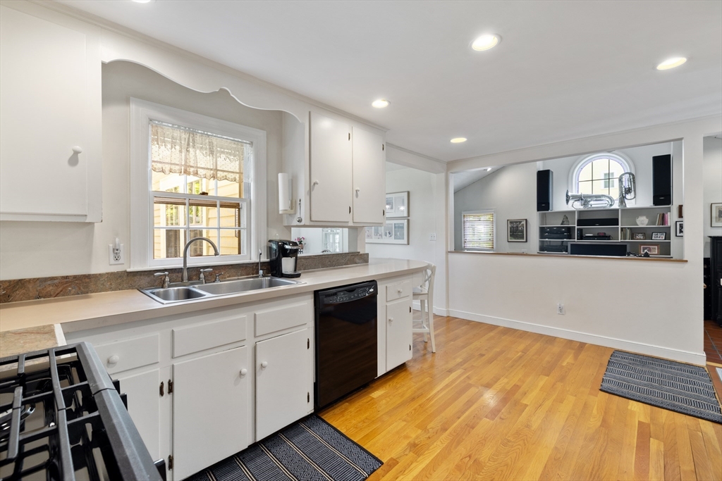 4 Longfellow Road Lexington, MA 02420 - Photo 3 of 37 a large kitchen with stainless steel appliances granite countertop a sink and cabinets