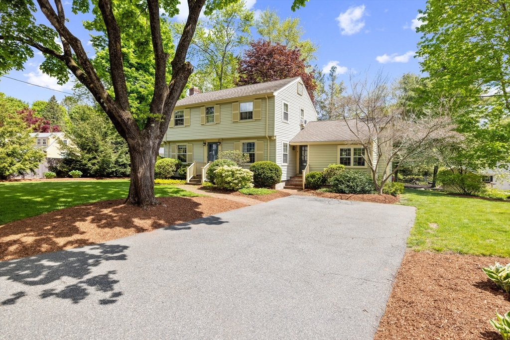 4 Longfellow Road Lexington, MA 02420 - Photo 32 of 37 a front view of a house with a yard