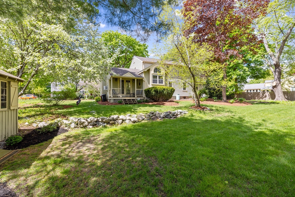 4 Longfellow Road Lexington, MA 02420 - Photo 35 of 37 a front view of a house with garden