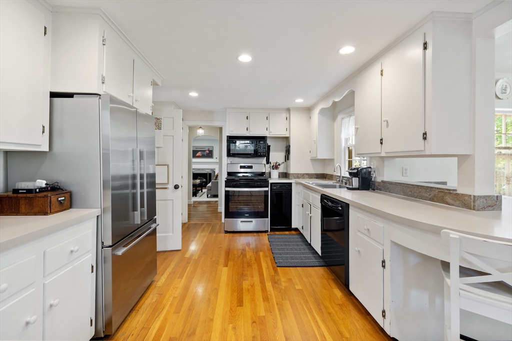 4 Longfellow Road Lexington, MA 02420 - Photo 5 of 37 a large kitchen with cabinets stainless steel appliances and a counter space