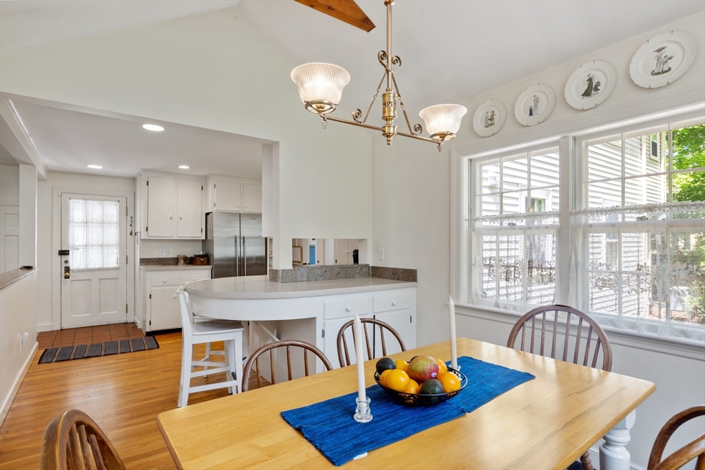 4 Longfellow Road Lexington, MA 02420 - Photo 7 of 37 a view of a dining room with furniture a chandelier and wooden floor