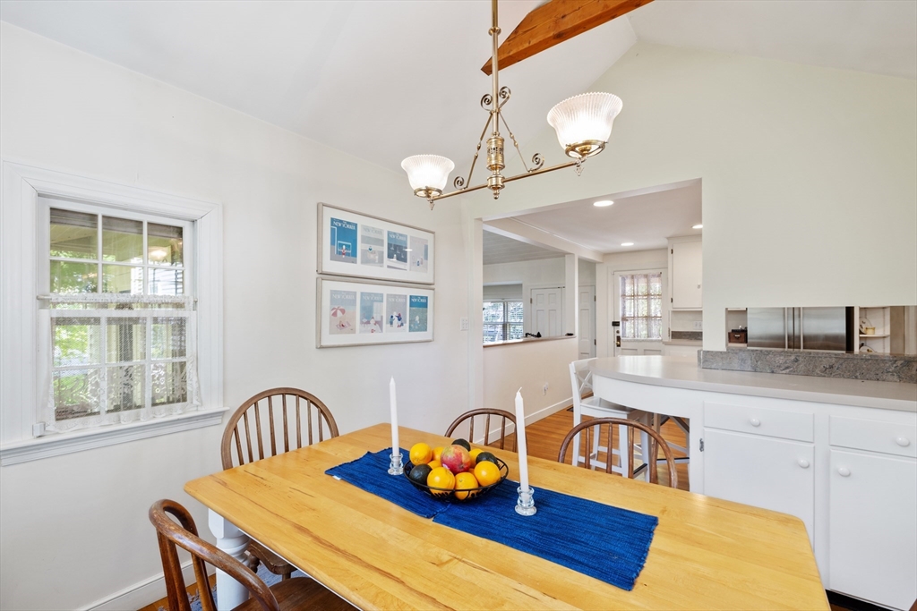 4 Longfellow Road Lexington, MA 02420 - Photo 8 of 37 a kitchen with stainless steel appliances granite countertop a dining table chairs sink and wooden floor