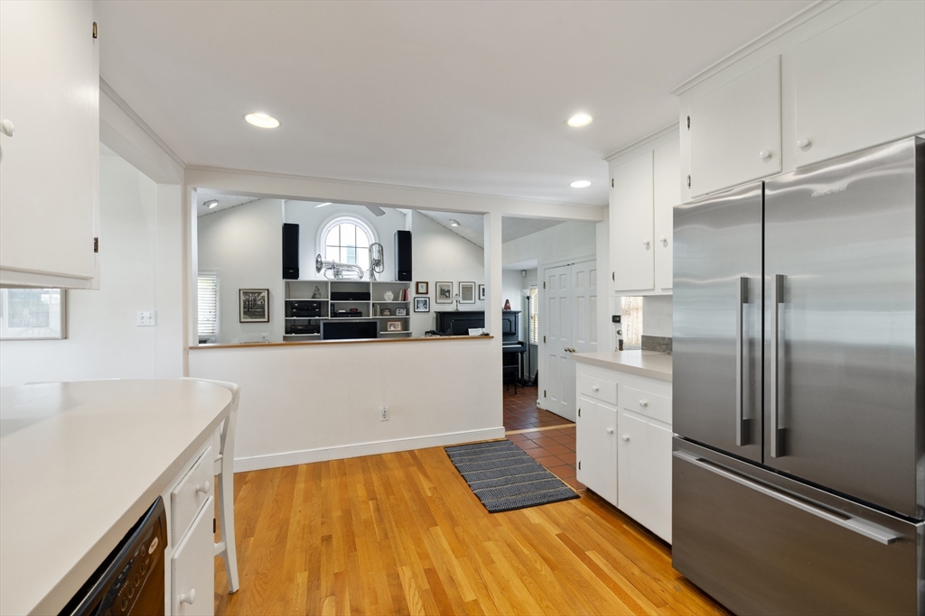 4 Longfellow Road Lexington, MA 02420 - Photo 9 of 37 a kitchen with stainless steel appliances a refrigerator and a stove top oven