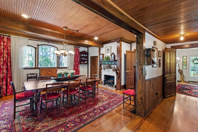 a view of a hallway with a couch and a window