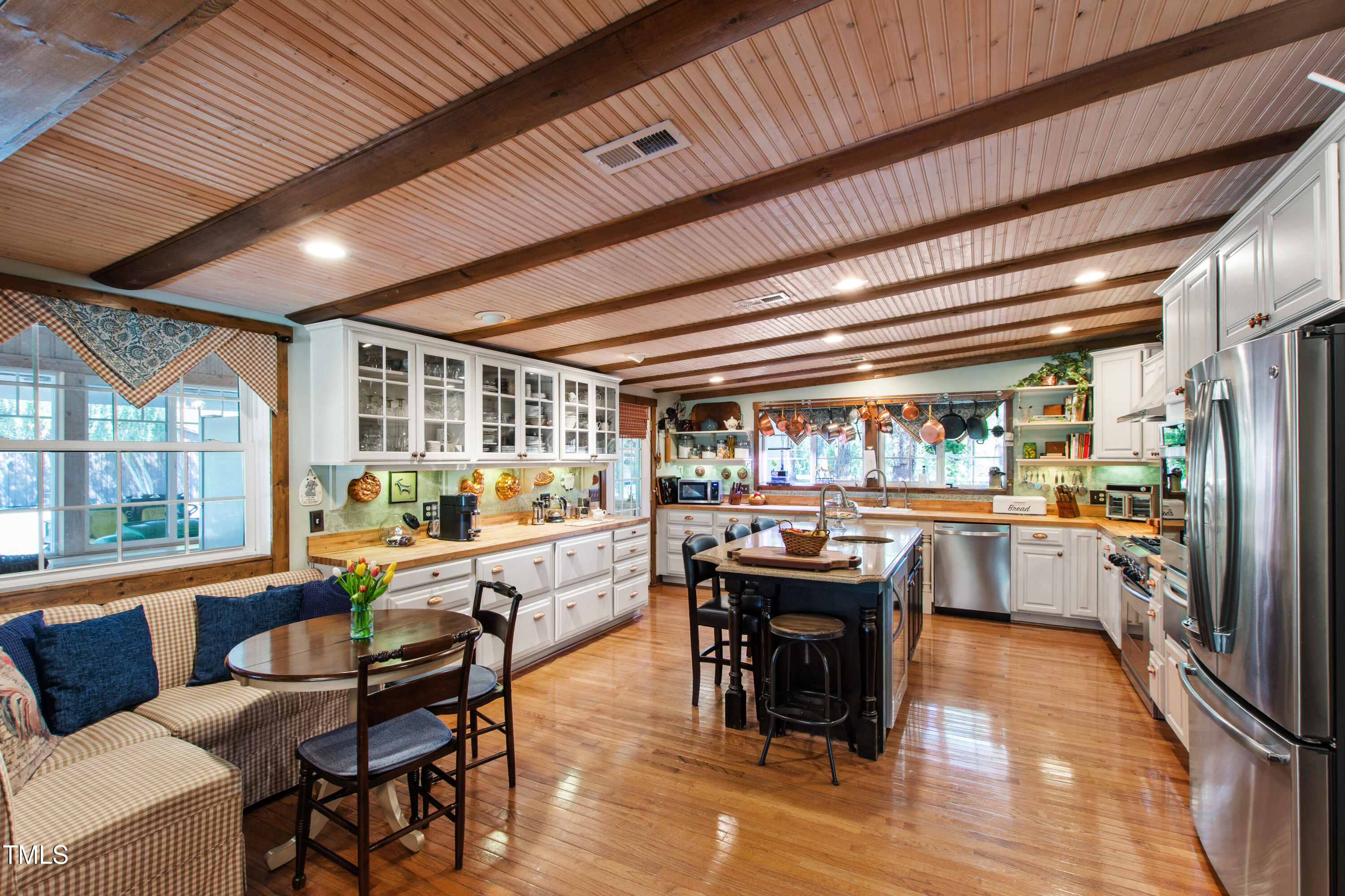 2451 Brick Mill Road Erwin, NC 28339 - Photo 13 of 101 a dining hall with stainless steel appliances kitchen island granite countertop a table chairs and a chandelier