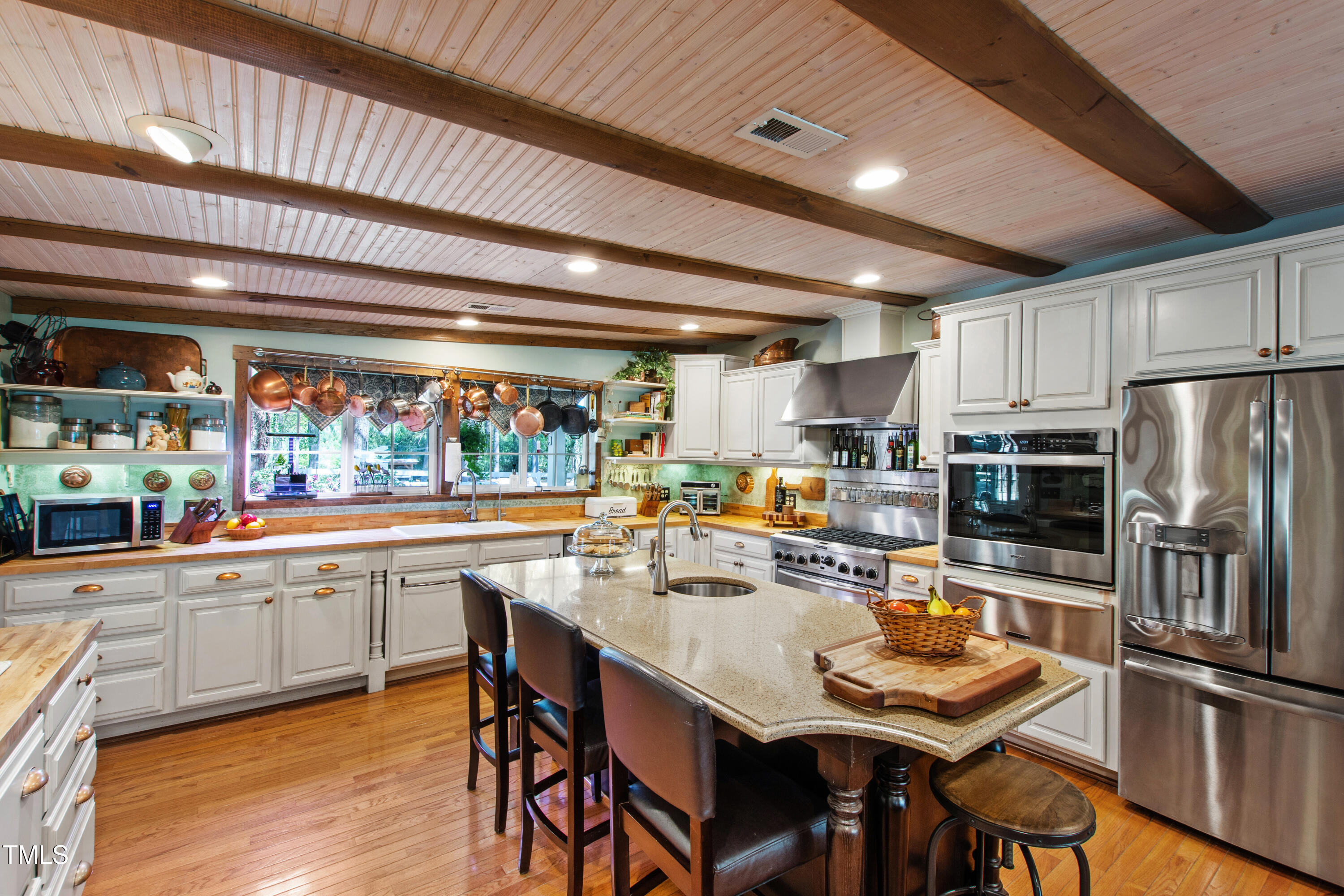 2451 Brick Mill Road Erwin, NC 28339 - Photo 14 of 101 a kitchen with stainless steel appliances granite countertop a dining table chairs refrigerator and cabinets