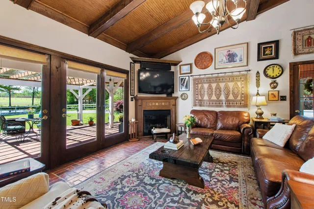 a front view of a house with a garden and trees