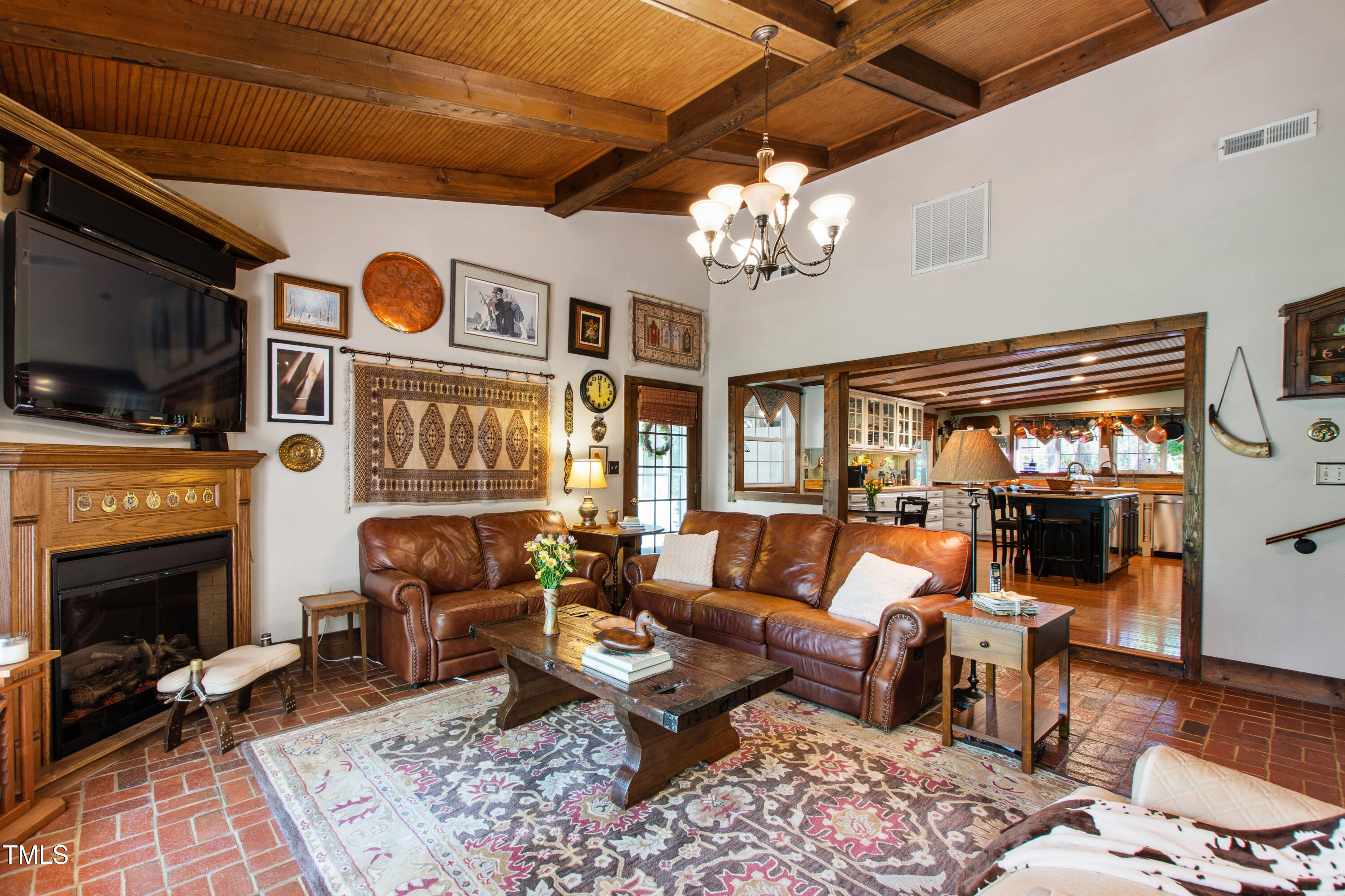 2451 Brick Mill Road Erwin, NC 28339 - Photo 20 of 101 a living room with fireplace furniture and a flat screen tv