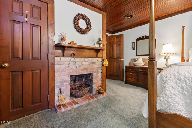 a bedroom with a bed and a desk