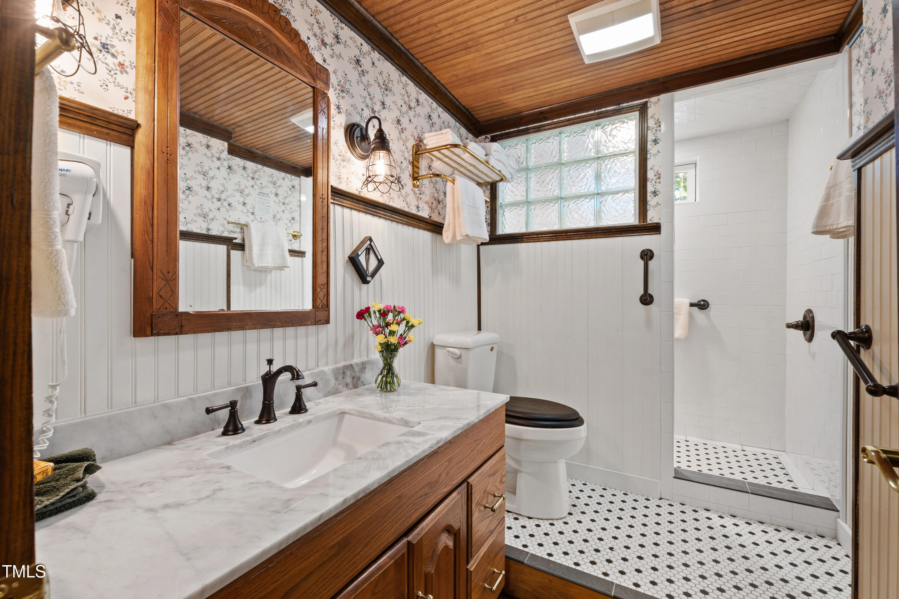 2451 Brick Mill Road Erwin, NC 28339 - Photo 31 of 101 a bathroom with a granite countertop sink a toilet a mirror and shower