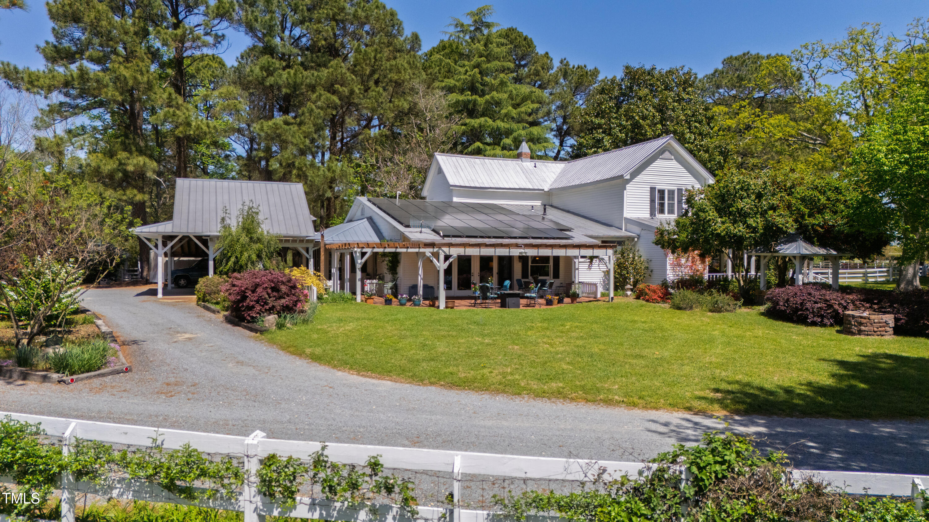 2451 Brick Mill Road Erwin, NC 28339 - Photo 34 of 101 a front view of a house with a garden and trees