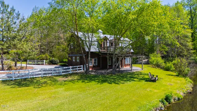 a front view of a house with outdoor seating