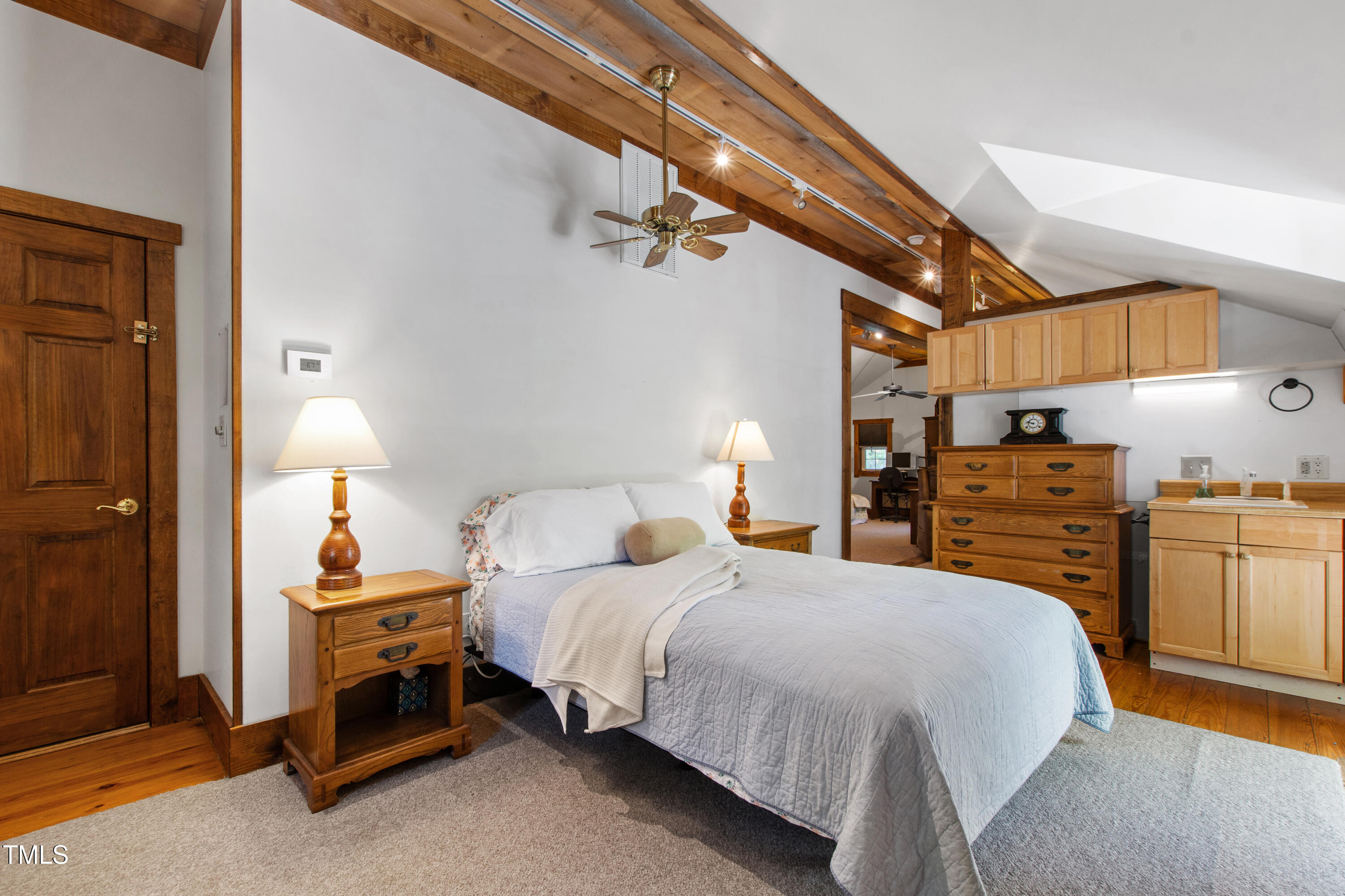2451 Brick Mill Road Erwin, NC 28339 - Photo 51 of 101 a bedroom with a bed and dresser