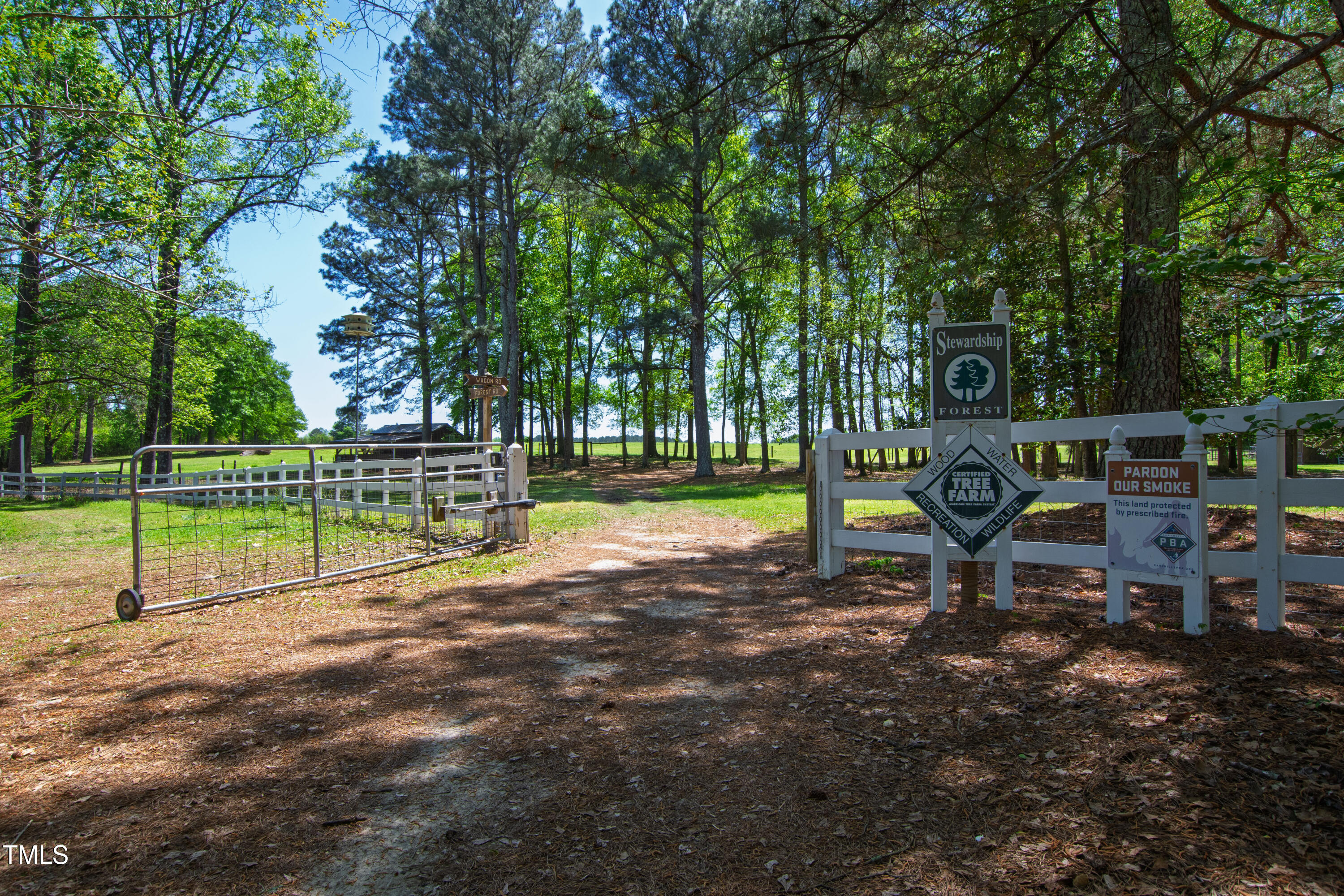 2451 Brick Mill Road Erwin, NC 28339 - Photo 76 of 101 a view of a park with swings and a small yard