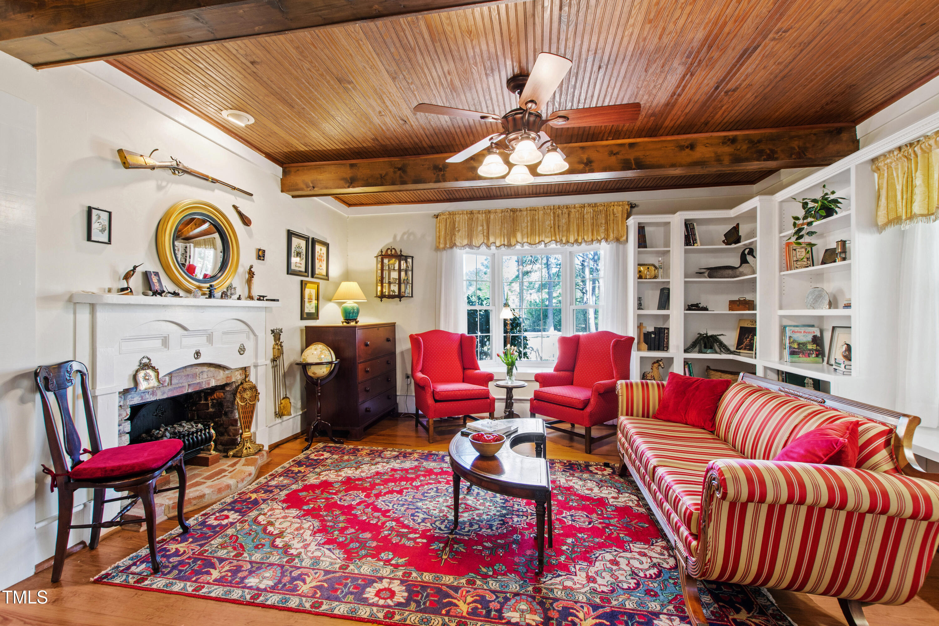 2451 Brick Mill Road Erwin, NC 28339 - Photo 8 of 101 a living room with furniture a rug and a chandelier