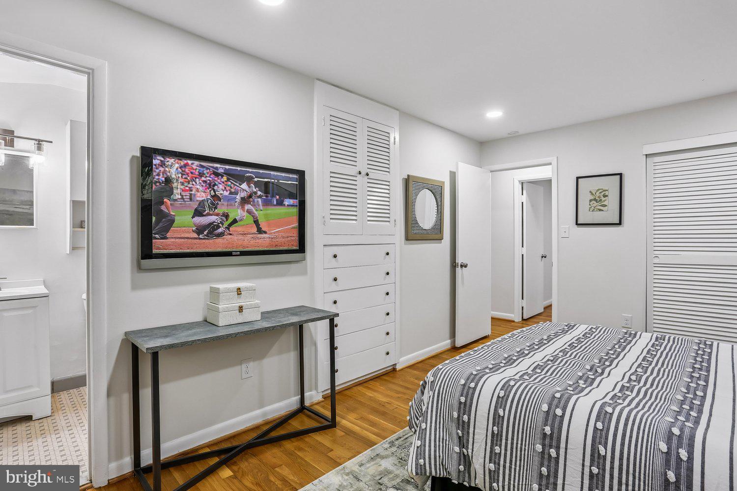 907 Hoyt Street Silver Spring, MD 20902 - Photo 28 of 69 a bedroom with a bed and a flat screen tv