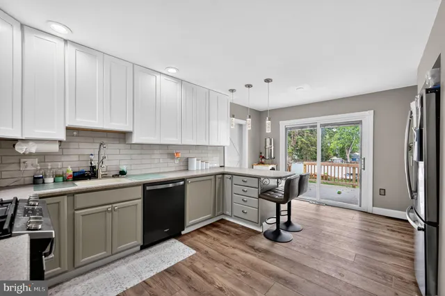 a view of a kitchen with electric appliances